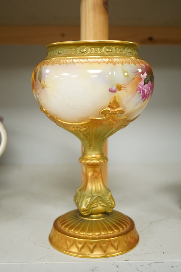 A Royal Worcester pedestal vase decorated with roses, marked to the base 1813 10.54. Condition - good.